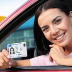 New driver receiving a driver license after completing the application process