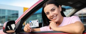 New driver receiving a driver license after completing the application process