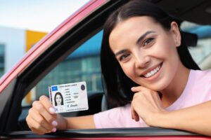 New driver receiving a driver license after completing the application process